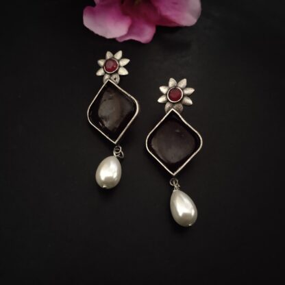 Maroon floral studs